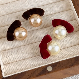 Vintage flocked bow earrings with elegant pearls in deep brown and burgundy autumn colors