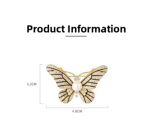 Detailed macro view showing the 3.2cm by 4.8cm dimensions of the butterfly brooch