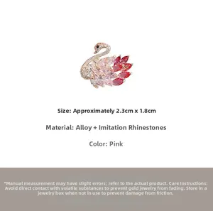 Macro view of pink swan brooch dimensions 2.3cm by 1.8cm with alloy crystal detail