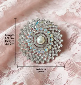 Macro shot of a luxury vintage sunburst brooch with pearl, opals and crystals