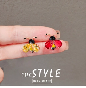 Détails des broches abeille et coccinelle ornées de zircons cubiques en forme de poire