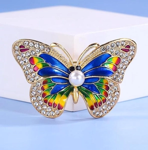 Elegant gold alloy butterfly brooch with colorful enamel wings and sparkling rhinestones