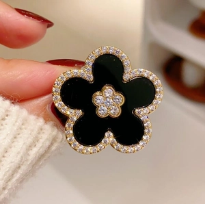 Elegant vintage black five-petal flower brooch with diamond borders and golden plating