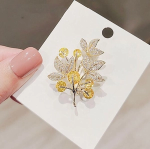 Lucky flower tree brooch with yellow crystals and pave diamonds on golden alloy