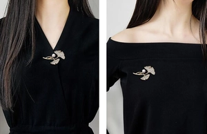 Ginkgo leaf brooch with pearls and crystals shown on V-neck and boat-neck black outfits