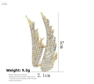Detailed view of luxury crystal wing brooch with 5cm height and 2.1cm width dimensions