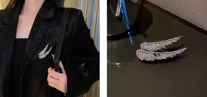 Detailed macro view of angel wing brooch with sparkling rhinestones on a blazer