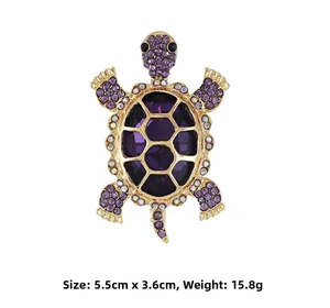 Detailed view of turtle brooch featuring purple crystals and gold alloy plating