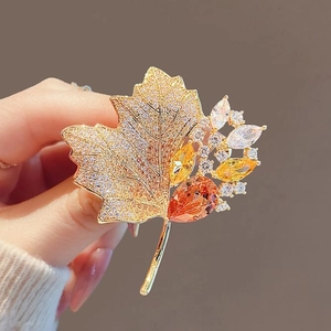 Luxury vintage maple leaf brooch with golden crystals and orange rhinestones for women