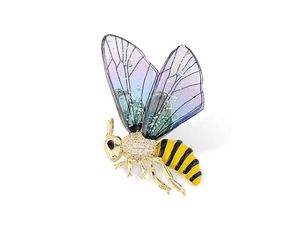 Close-up of golden bee brooch with sparkling crystals and colorful enamel wings