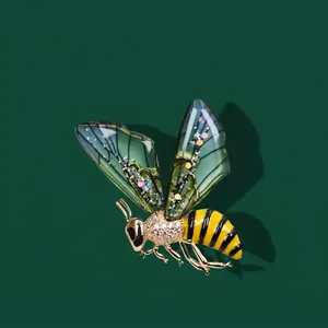 Exquisite golden honey bee brooch with green gradient wings and white zircon crystals