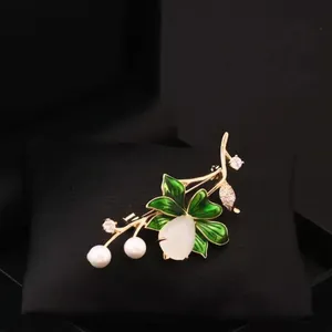 Elegant lotus flower brooch with green enamel leaves, white faux jade, and pearls for coats