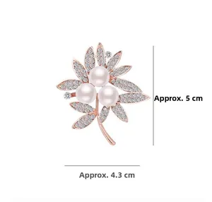 Detail view of flower brooch with pearls and crystals, measuring 5 cm by 4.3 cm