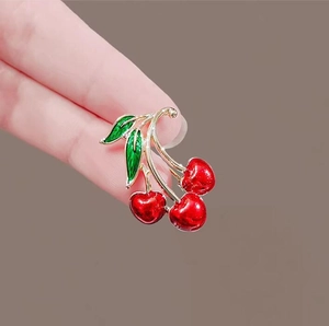 Elegant red cherry brooch with gold metal frame and green enamel leaves for women