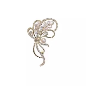 Élégante broche bouquet de fleurs dorées avec cristaux brillants et une perle blanche