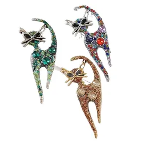 Detailed macro view of cat brooches set with multi-colored rhinestones on alloy metal