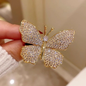 Exquisite French vintage gold butterfly brooch with shimmering rhinestones and crystals