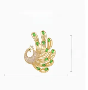 Detailed close-up of emerald crystal peacock brooch with 50mm by 38mm dimensions