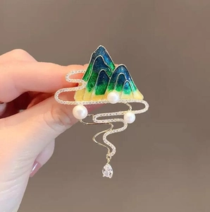 Elegant mountain landscape brooch with green enamel, pearls and crystal tassel drop