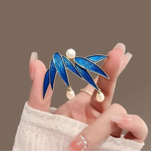 Chinese style bamboo leaf brooch with blue enamel and white pearls on gold-toned metal