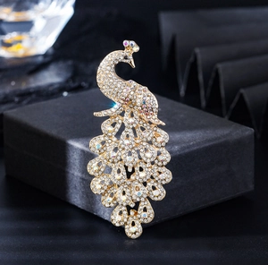 Detailed macro view of an elegant peacock brooch with sparkling colorful rhinestones