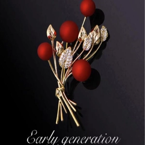 Elegant vintage floral brooch with red matte pearls and golden leaves on black backdrop