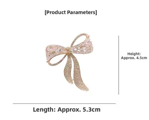 Detailed view of luxury bow brooch with pink rhinestones and 4.5cm by 5.3cm dimensions