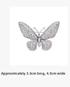 Detail view of vintage butterfly brooch with silver cubic zirconia and 4.5cm width size