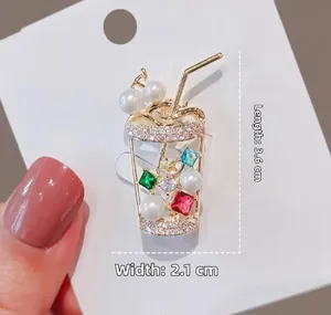 Detailed view of rhinestone pearl bubble tea brooch with dimensions 3.6cm by 2.1cm