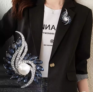 Elegant silver brooch with large white pearl, blue gemstones and rhinestones for women