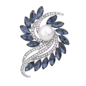 Elegant floral spiral brooch with blue marquise crystals and a center white pearl