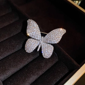 Sparkling crystal butterfly brooch pin for women in a luxury black velvet jewelry box