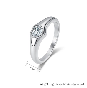 Macro detail of 7mm stainless steel ring featuring a heart-shaped cubic zirconia stone