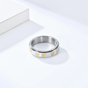 Rotating stainless steel dog paw and heart ring with silver and gold finish for stress relief