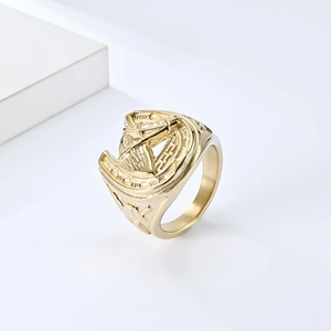 Macro view of vintage gold horseshoe ring featuring detailed horse head relief carving