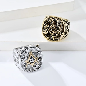 Detail of vintage Masonic rings in gold and silver finish with embossed floral patterns