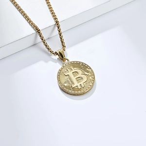 Macro view of 18K gold plated Bitcoin pendant showing textured surface and round chain