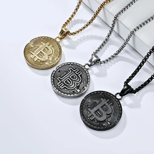 Hip hop style gold, silver, and black Bitcoin pendant necklaces on geometric display