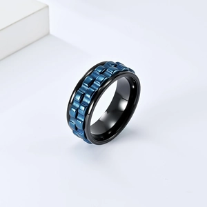 Macro shot of industrial rotatable gear ring with blue and black mechanical plating finish