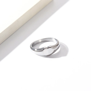 Detailed view of heart-shaped signet ring with a polished silver stainless steel finish
