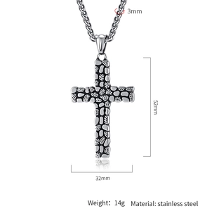 Detail of stainless steel cross necklace with pebble texture and size measurements
