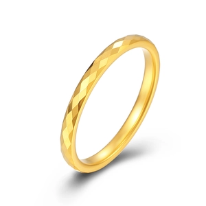 Minimalist tungsten ring with diamond-cut geometric pattern on white background