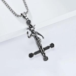 Macro detail of gothic inverted cross necklace featuring a Baphomet goat head pendant