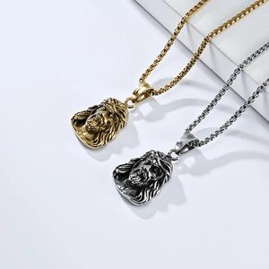 Macro detail of gold and silver Jesus portrait pendant on a box chain for men