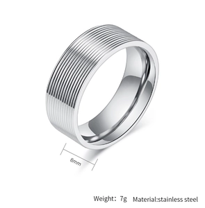 Macro shot of 8mm grooved stainless steel ring band with 7g weight and modern texture