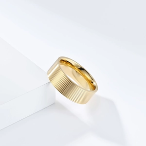 Golden titanium steel ring featuring multi-layer horizontal grooves and polished finish
