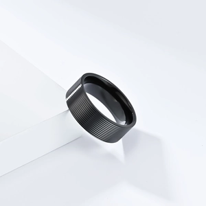 Minimalist matte black titanium steel ring with textured horizontal stripe finish for men