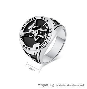 Detailed close-up of Saint Michael Archangel engraved oval ring in stainless steel