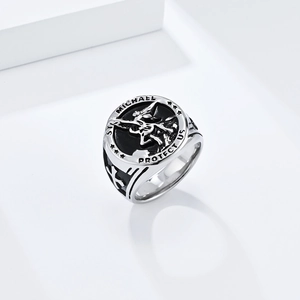 Detailed relief of Archangel St. Michael and engraving on a vintage steel ring