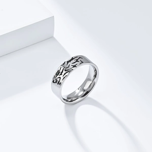 Modern titanium steel ring featuring a black tiger design with a green gemstone accent